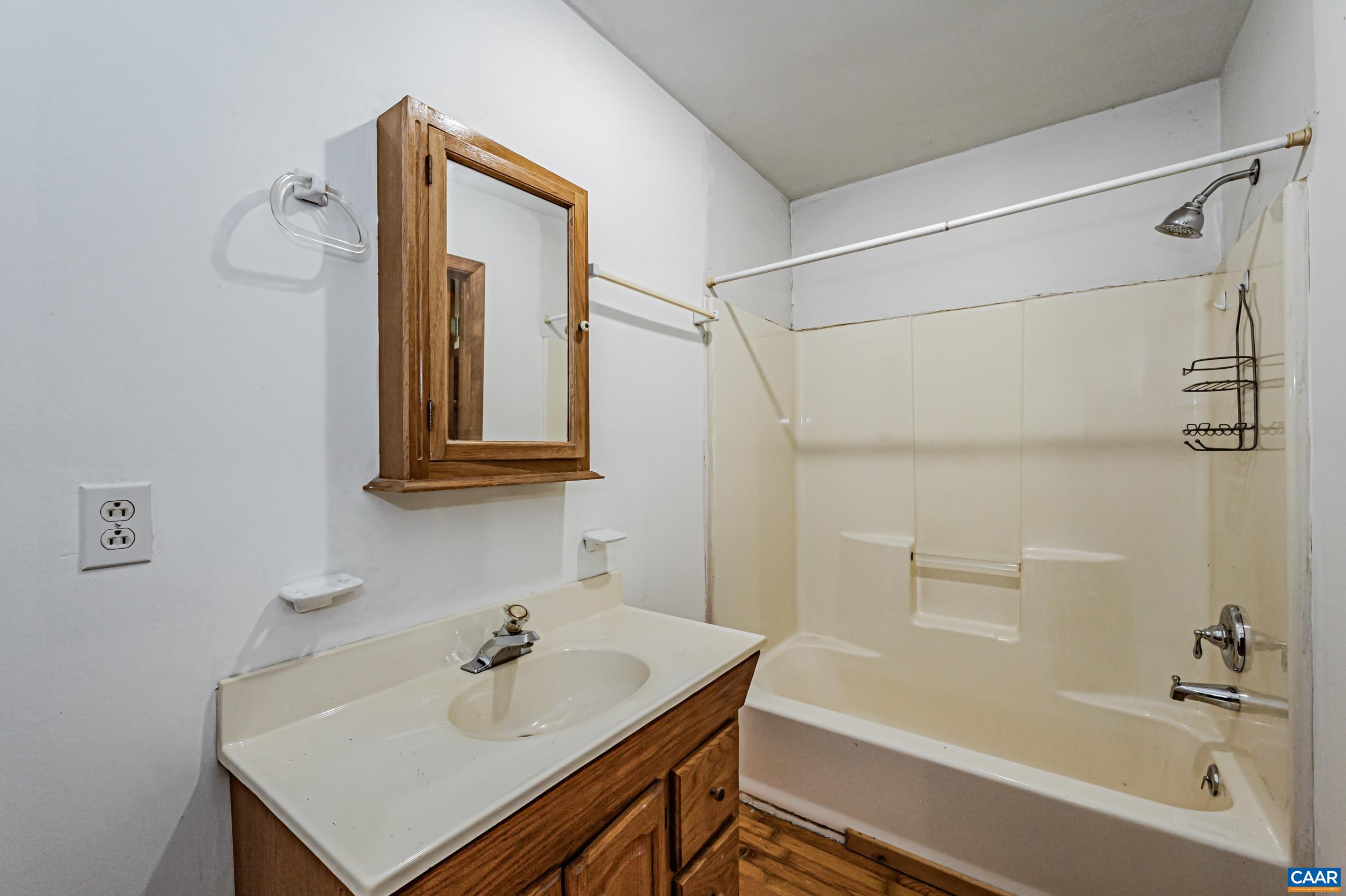 431 Graves Mill Road Madison, VA 22727 - Photo 11 of 26 a bathroom with a sink and a bathtub