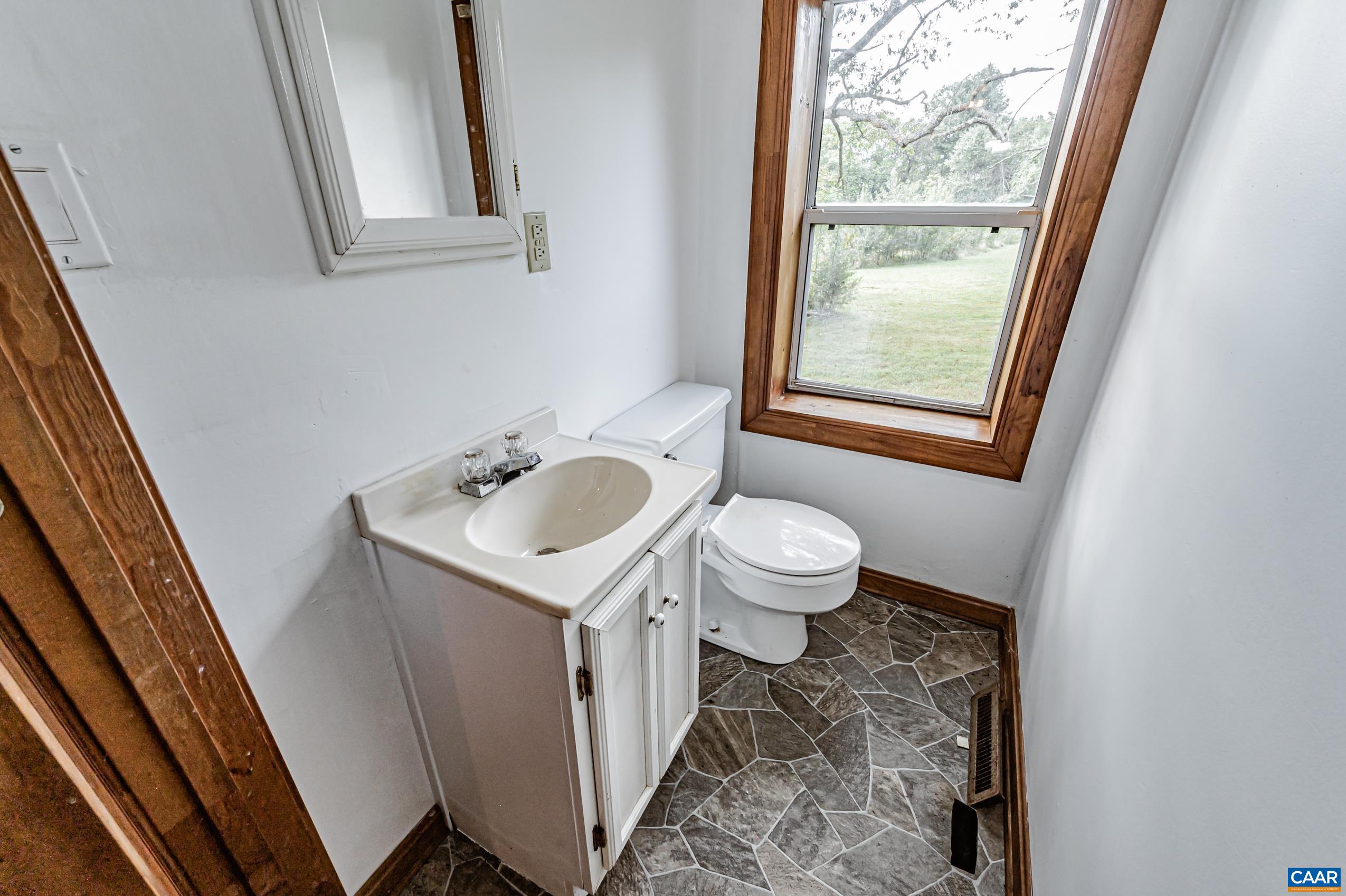 431 Graves Mill Road Madison, VA 22727 - Photo 18 of 26 a bathroom with a sink and a mirror