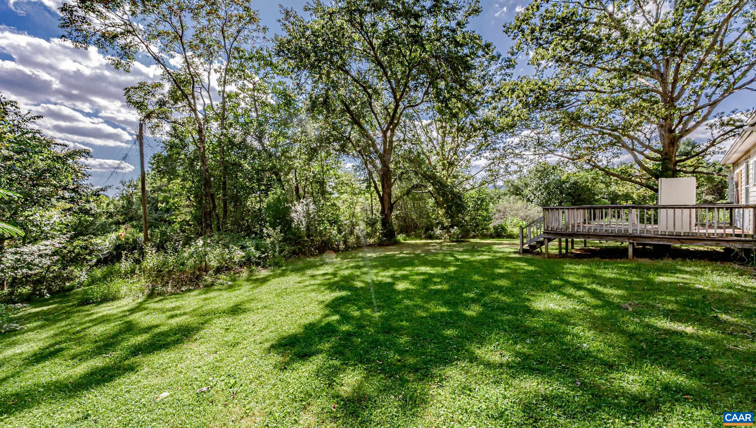 431 Graves Mill Road Madison, VA 22727 - Photo 20 of 26 a view of backyard with deck and garden