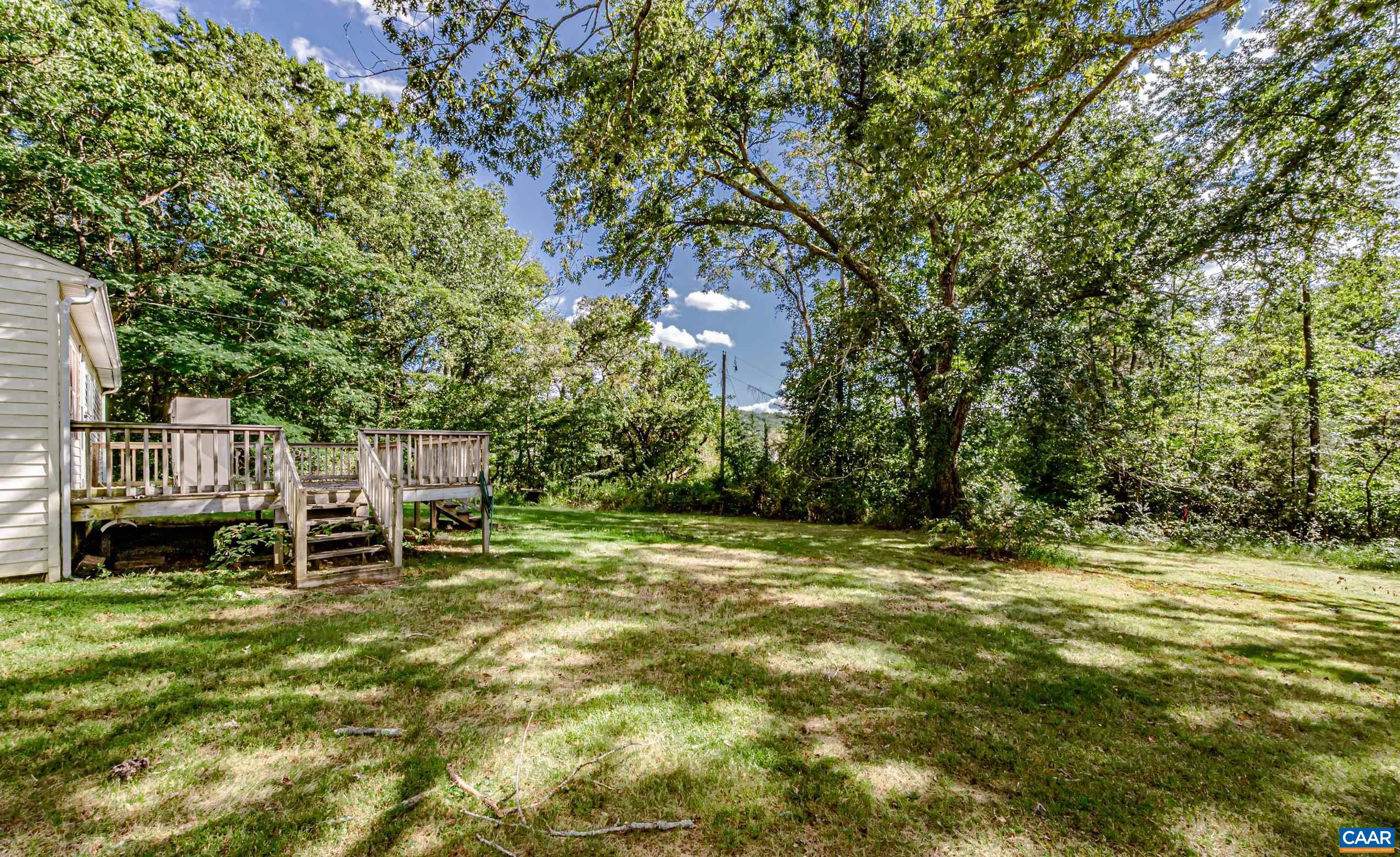 431 Graves Mill Road Madison, VA 22727 - Photo 23 of 26 a backyard of a house with table and chairs