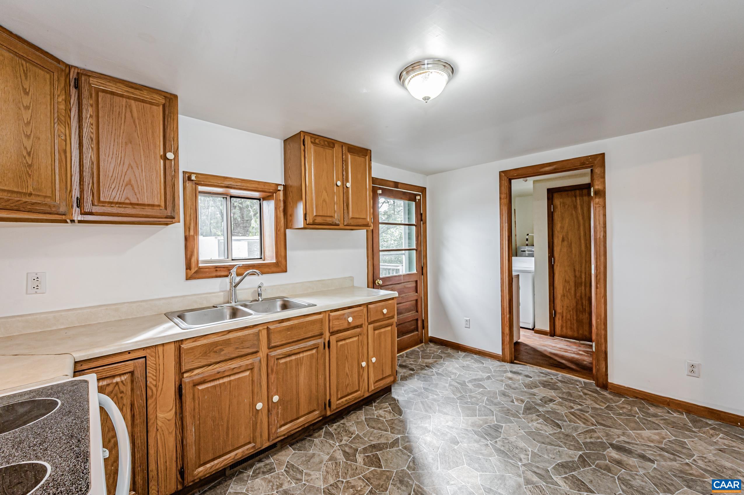 431 Graves Mill Road Madison, VA 22727 - Photo 3 of 26 a kitchen with a sink and cabinets