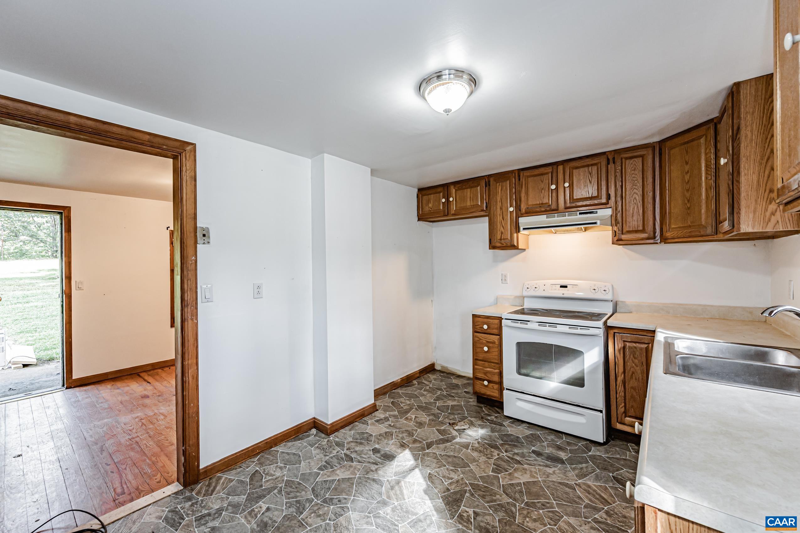 431 Graves Mill Road Madison, VA 22727 - Photo 4 of 26 a kitchen with a stove and a sink