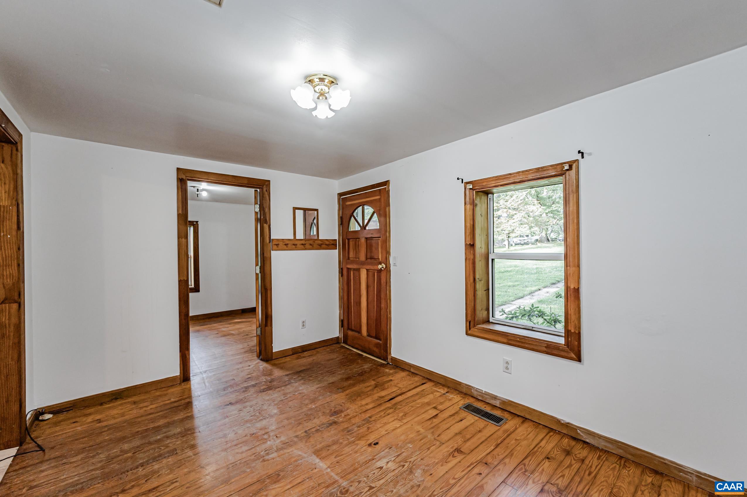 431 Graves Mill Road Madison, VA 22727 - Photo 6 of 26 wooden floor in an empty room with a window