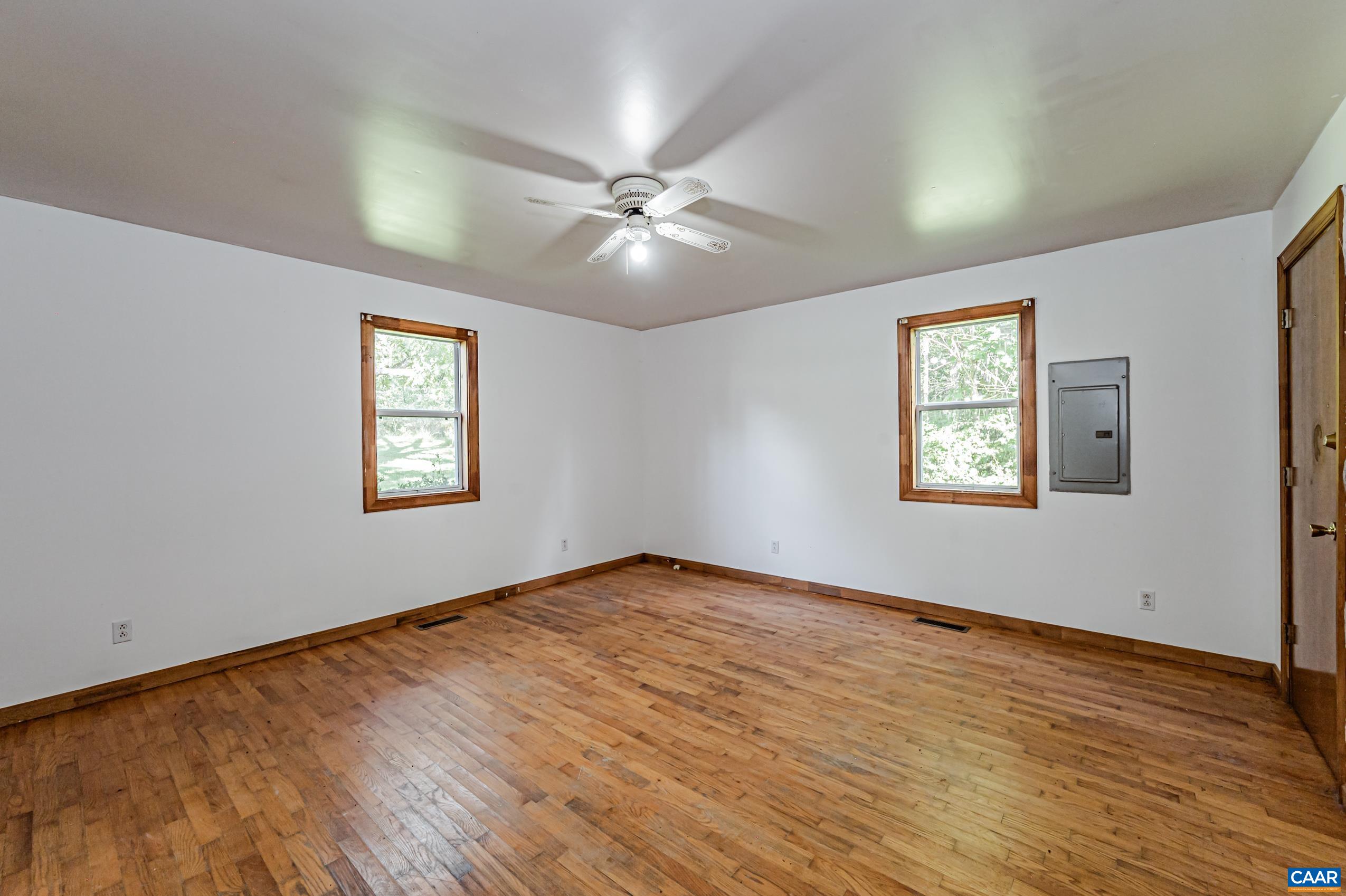 431 Graves Mill Road Madison, VA 22727 - Photo 8 of 26 wooden floor in an empty room with a window
