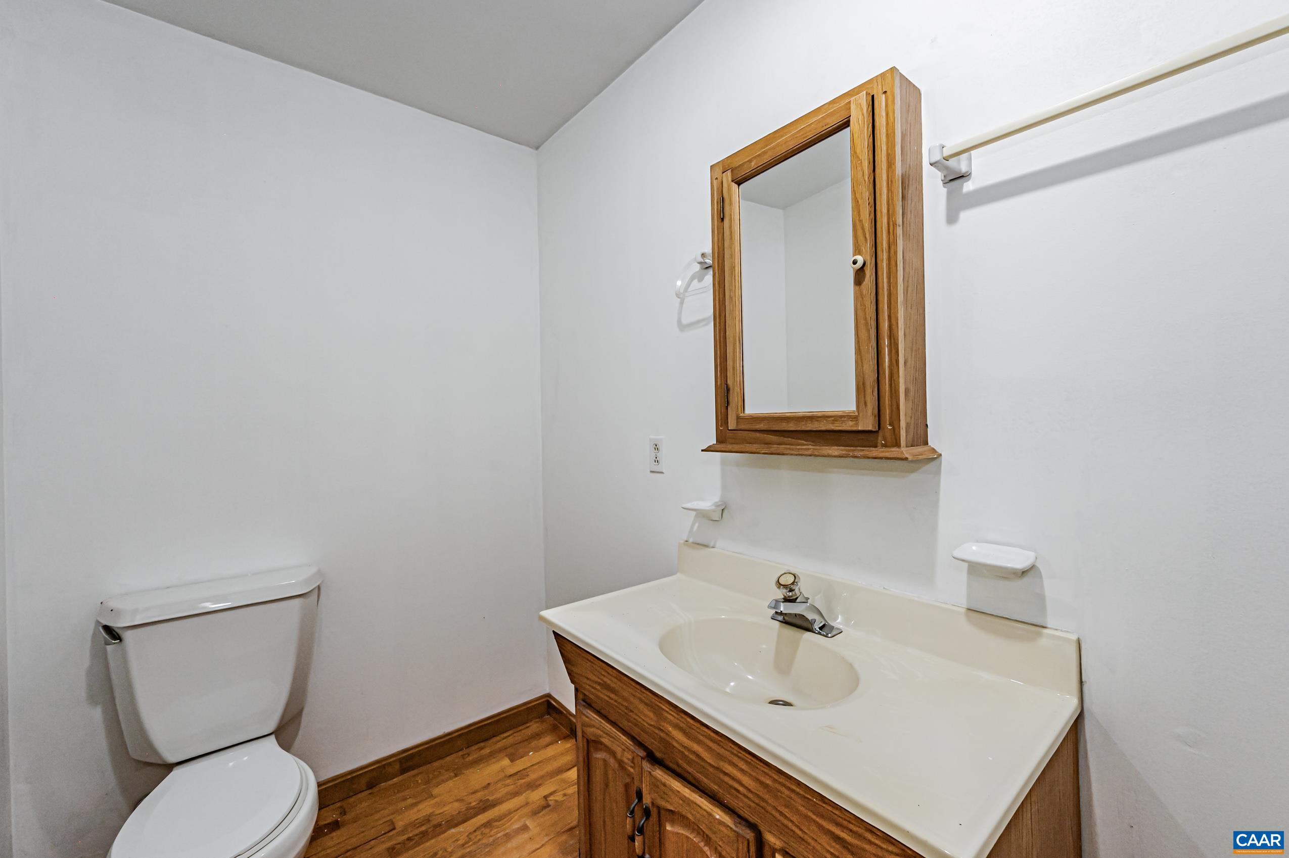431 Graves Mill Road Madison, VA 22727 - Photo 10 of 26 a bathroom with a toilet sink and mirror