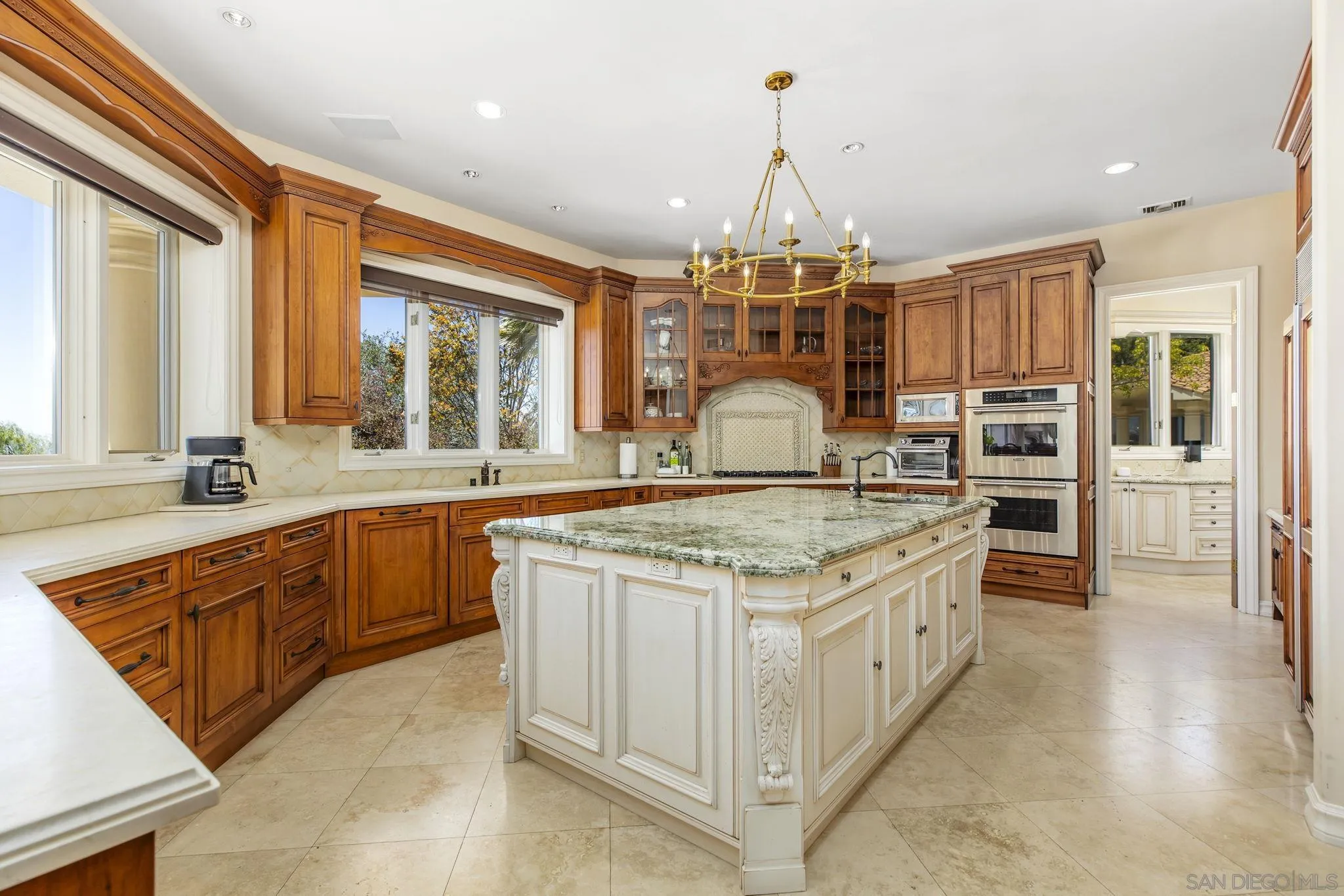 14440 Ridge Ranch Road Valley Center, CA 92082 - Photo 36 of 73 a kitchen with stainless steel appliances granite countertop a stove and a sink