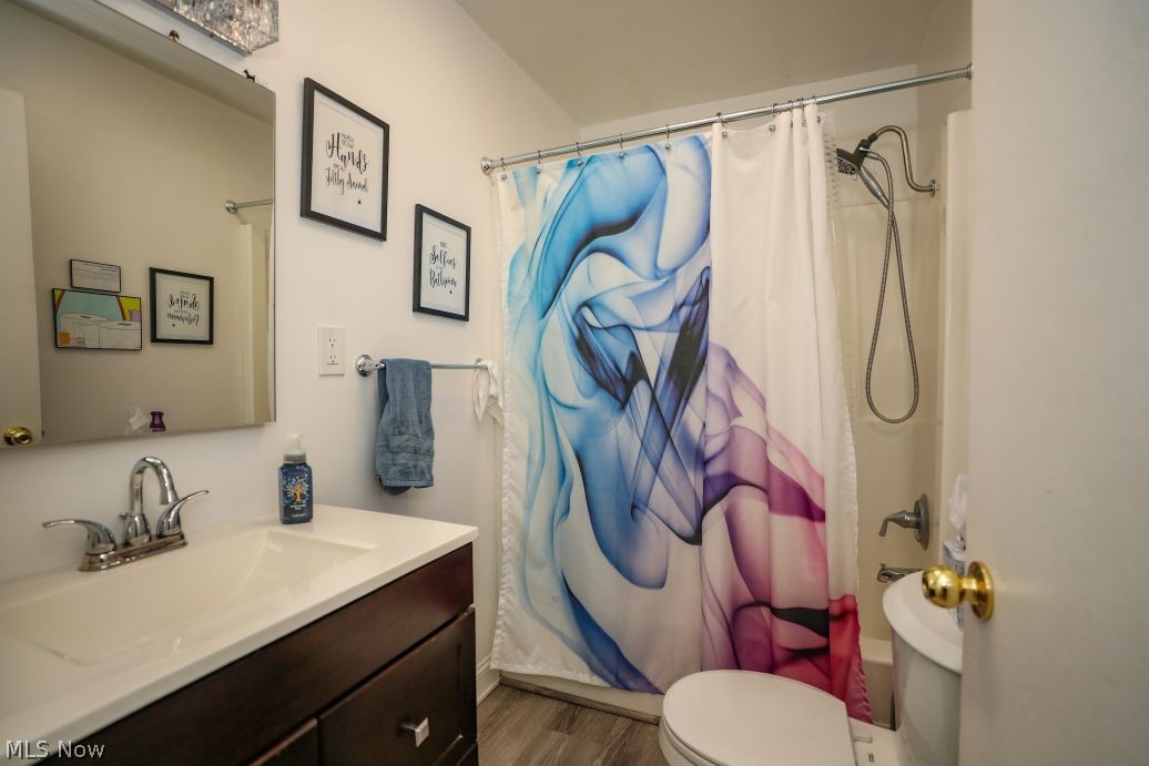 10676 Holcomb Road Newton Falls, OH 44444 - Photo 23 of 38 Full bathroom with vanity, LVT flooring, and shower / tub combo