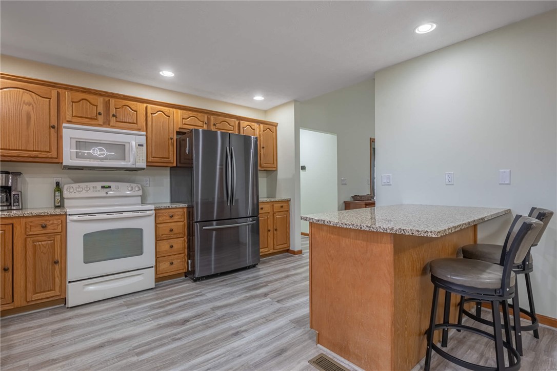 2645 Vance Road St. Paris, OH 43072 - Photo 11 of 35 This functional kitchen provides a comfortable space for cooking and casual dining with durable counters and cabinetry.