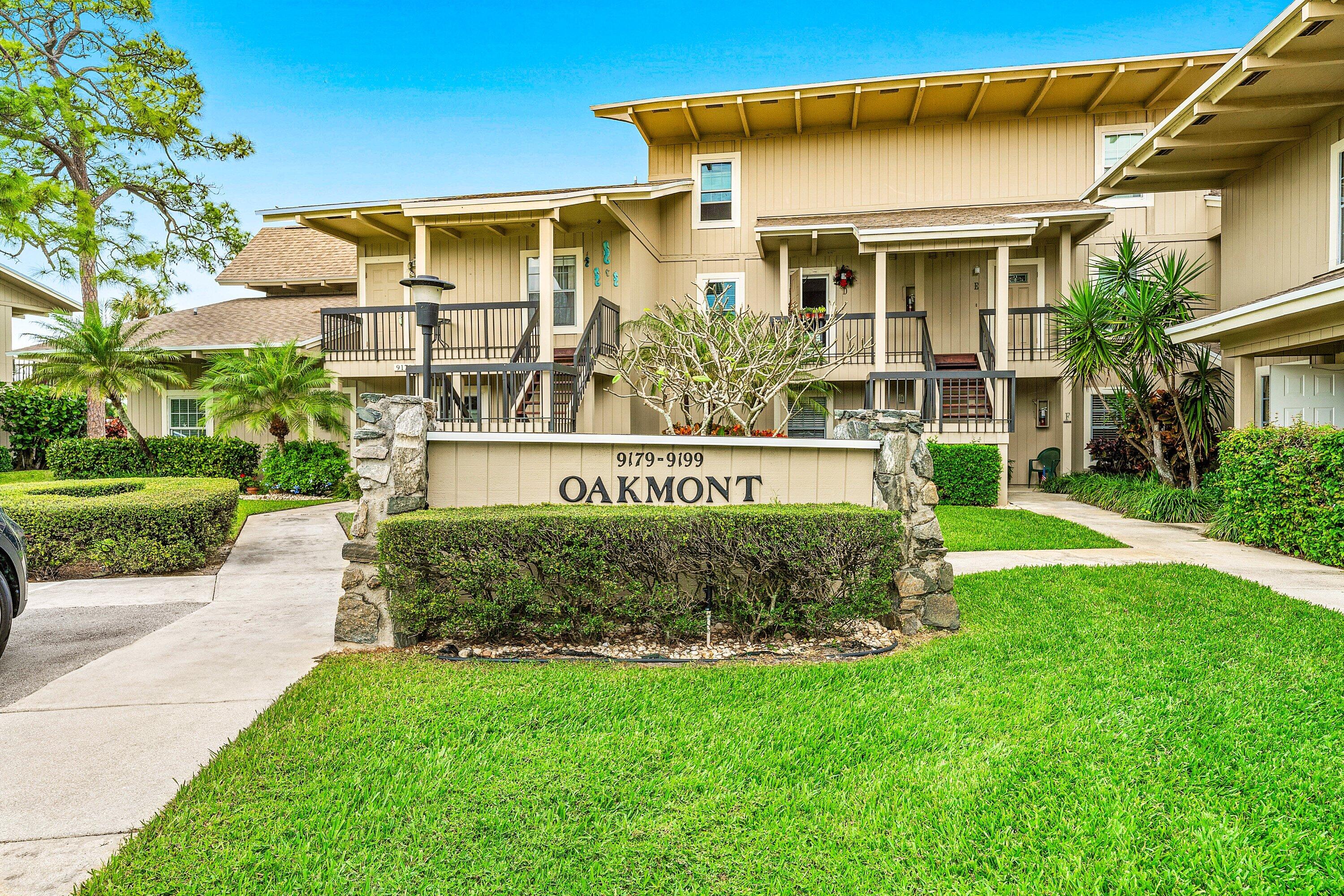 9179 Southeast Riverfront Terrace, Unit F Jupiter, FL 33469 - Photo 2 of 50 a front view of a house with garden