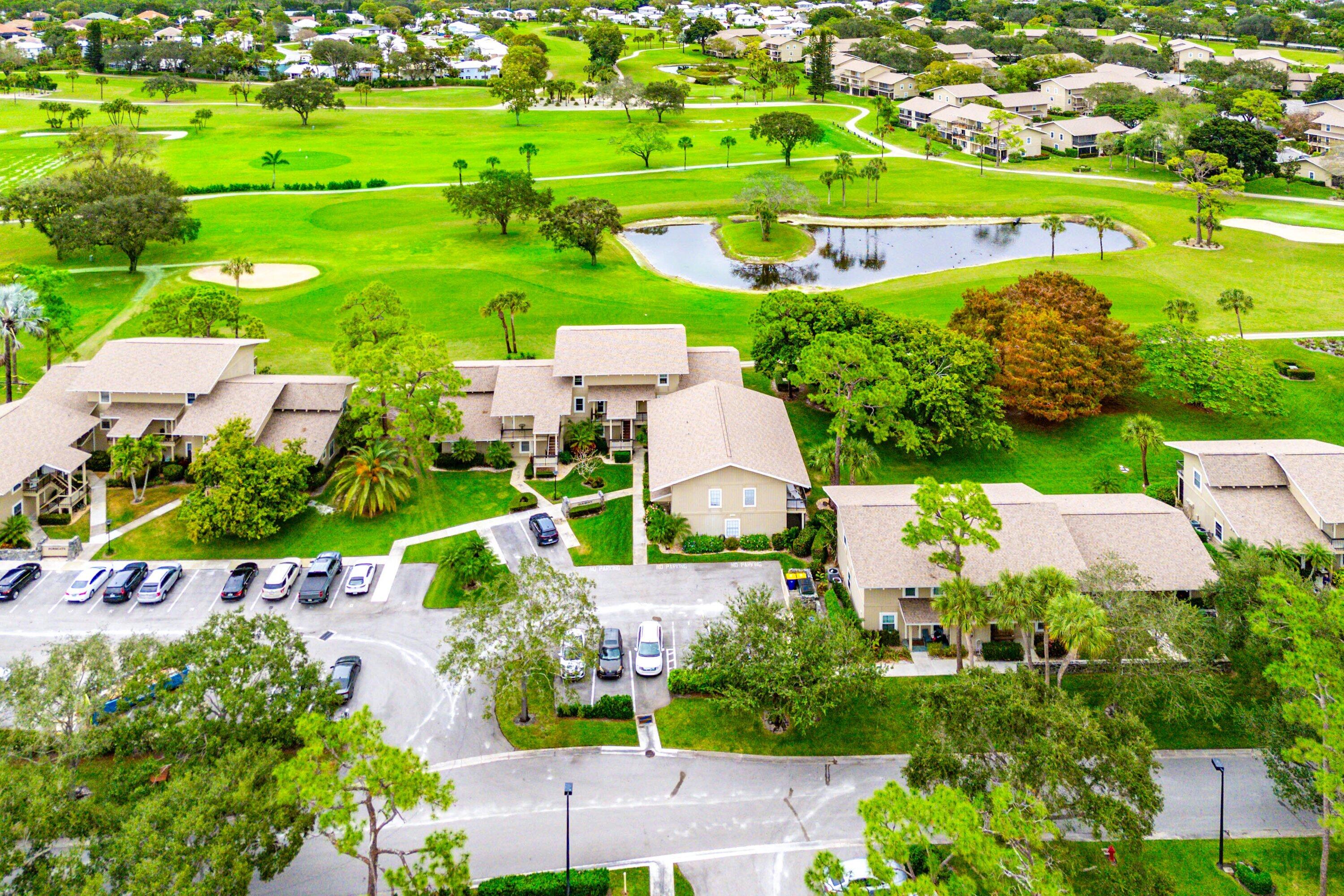 9179 Southeast Riverfront Terrace, Unit F Jupiter, FL 33469 - Photo 33 of 50 an aerial view of a houses with outdoor space and street view