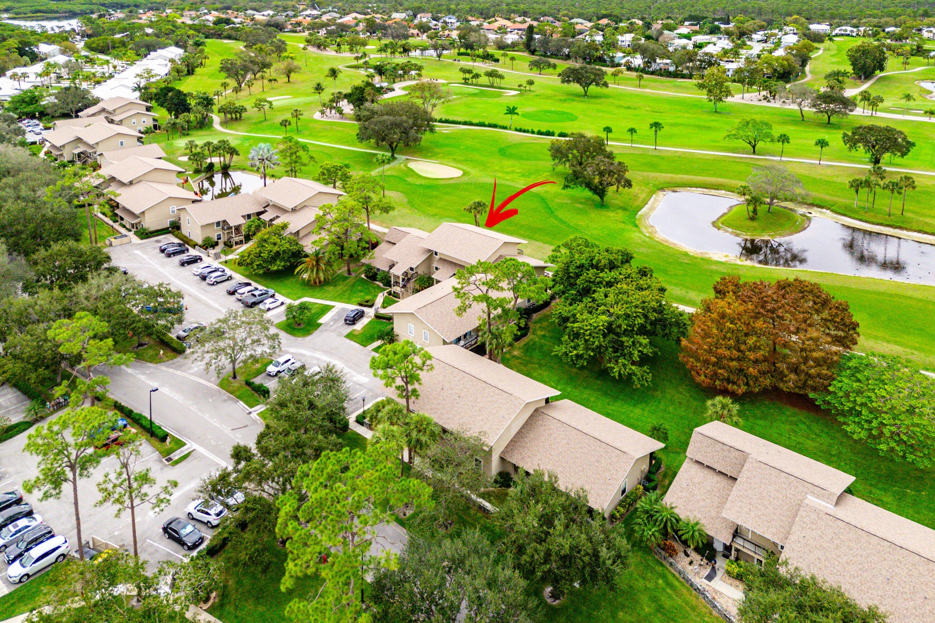 9179 Southeast Riverfront Terrace, Unit F Jupiter, FL 33469 - Photo 34 of 50 an aerial view of a residential houses with outdoor space and street view