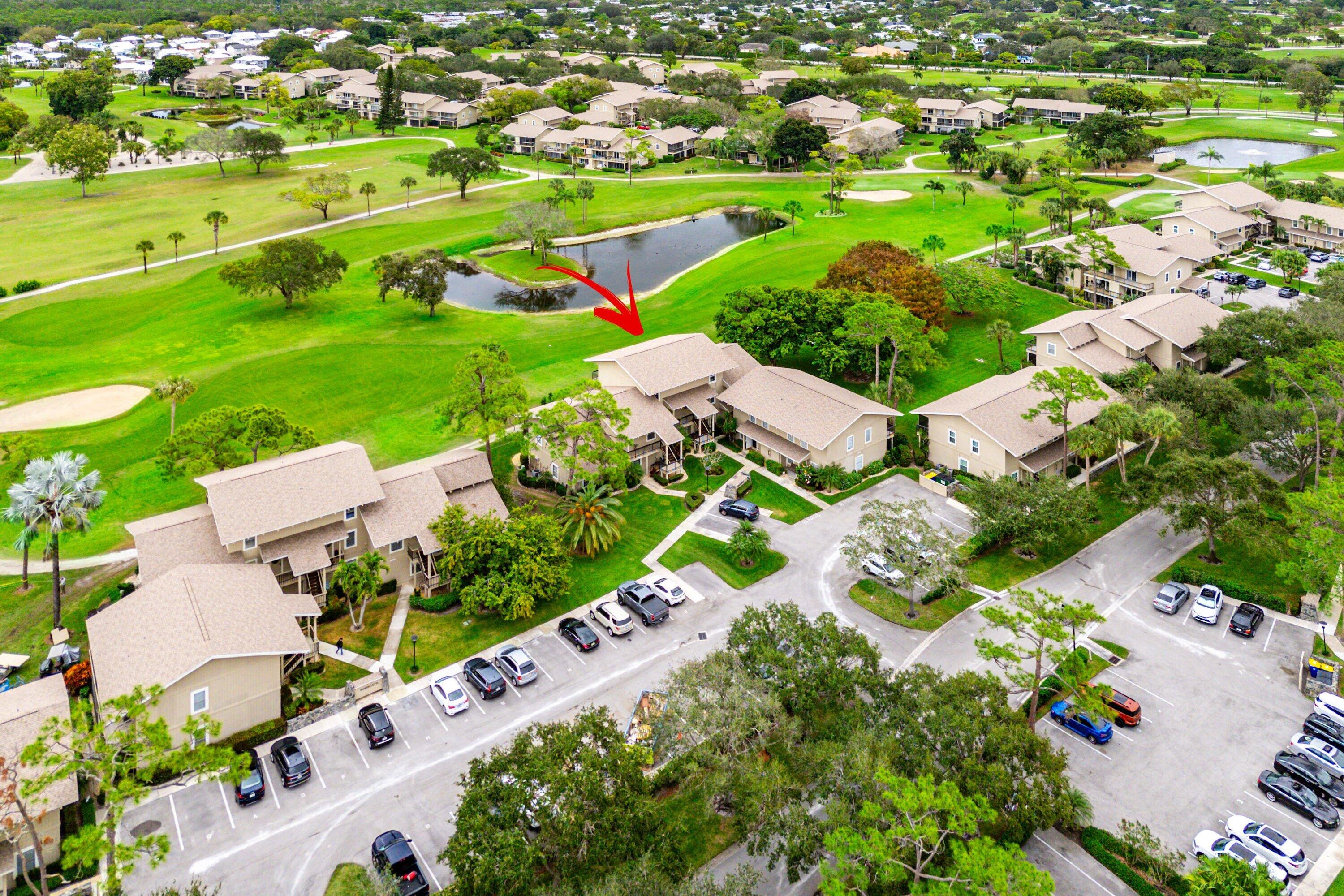 9179 Southeast Riverfront Terrace, Unit F Jupiter, FL 33469 - Photo 35 of 50 an aerial view of a residential houses with outdoor space and street view