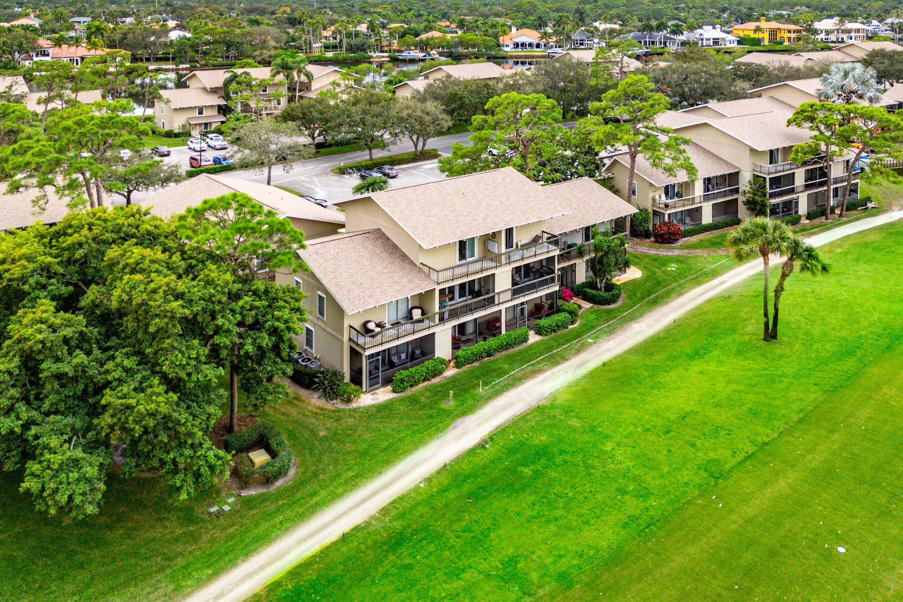 9179 Southeast Riverfront Terrace, Unit F Jupiter, FL 33469 - Photo 40 of 50 a aerial view of a house with a big yard