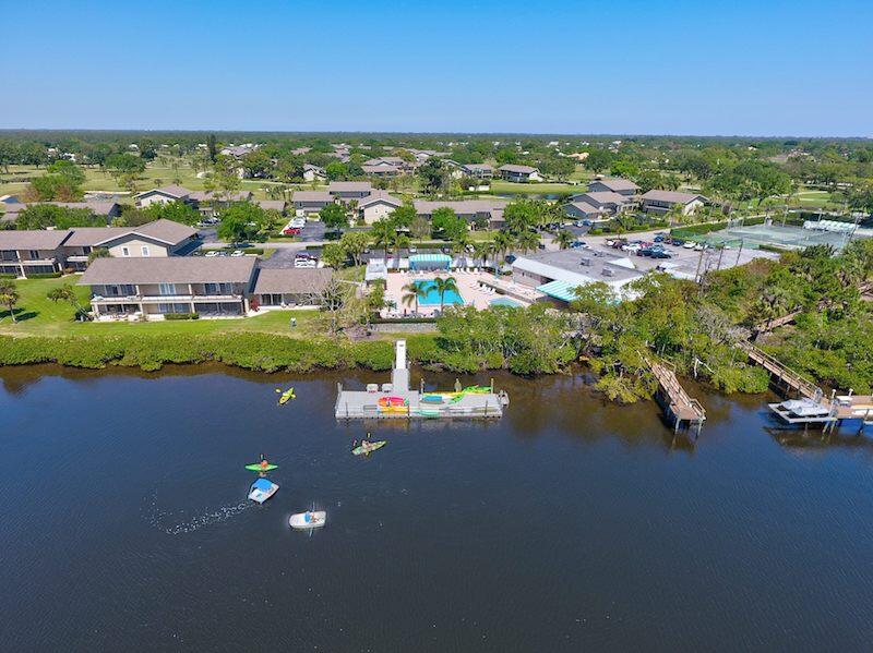 9179 Southeast Riverfront Terrace, Unit F Jupiter, FL 33469 - Photo 46 of 50 a view of a city with lots of residential buildings ocean and swimming pool