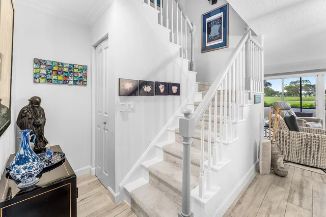 a view of entryway with workspace and stairs