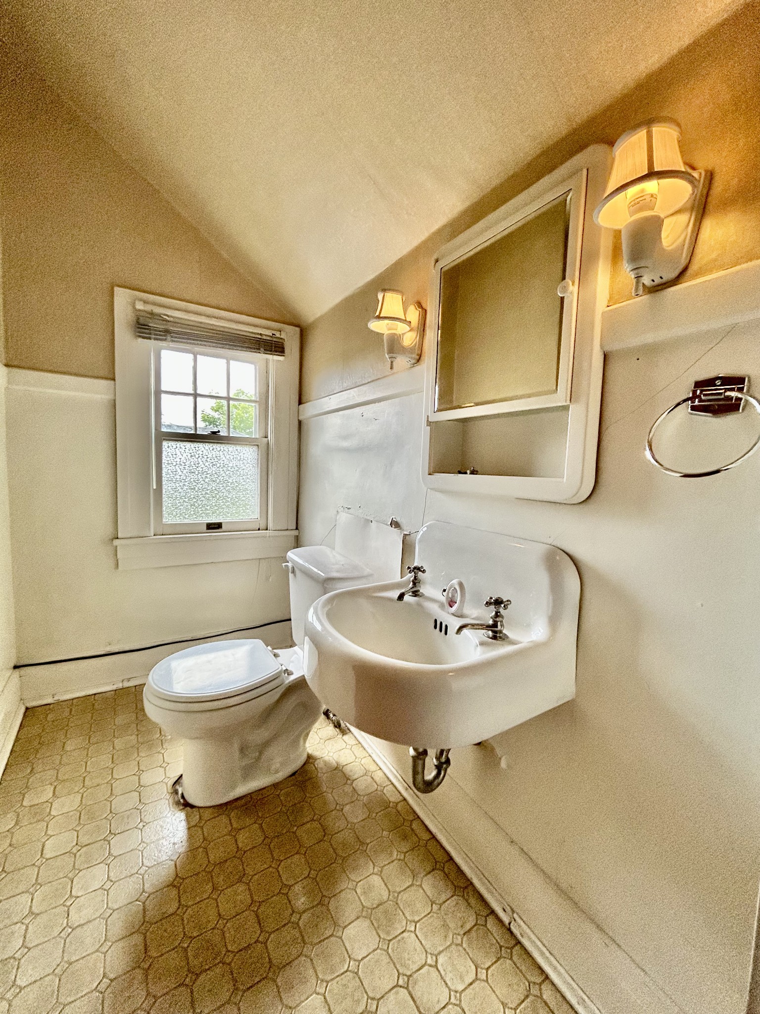 311 South 3rd Street Pulaski, TN 38478 - Photo 29 of 44 a bathroom with a sink a toilet and mirror