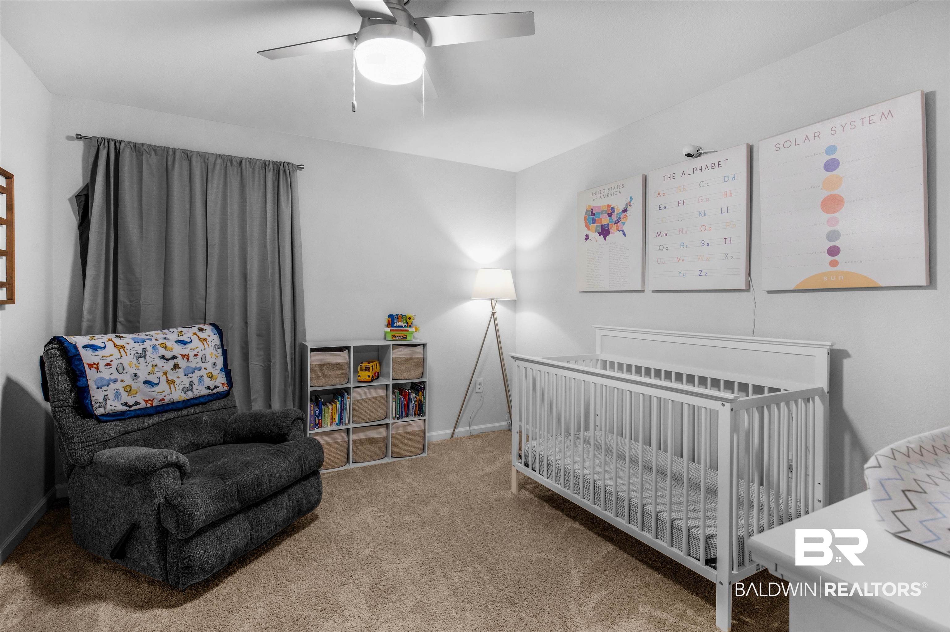 10313 Ruffian Route Daphne, AL 36526 - Photo 13 of 46 Carpeted bedroom with ceiling fan and a crib