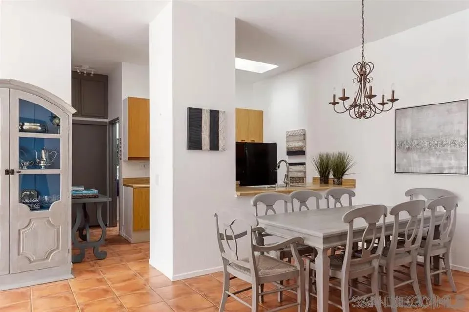 8328 Regents Road, Unit 3G San Diego, CA 92122 - Photo 3 of 8 a view of a dining room with furniture