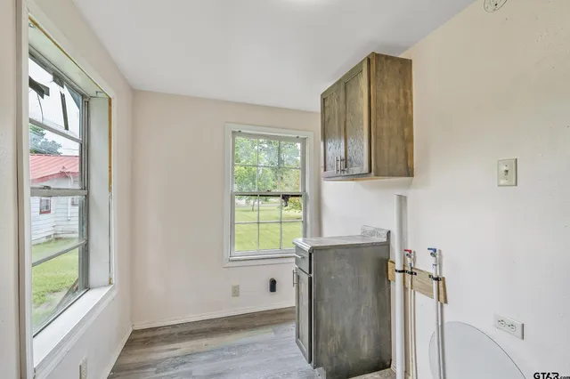 a view of cabinets and window in a room