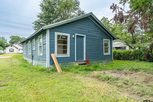 a backyard of a house with entertaining space