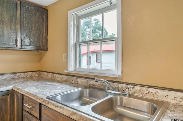 a kitchen with a sink and a window