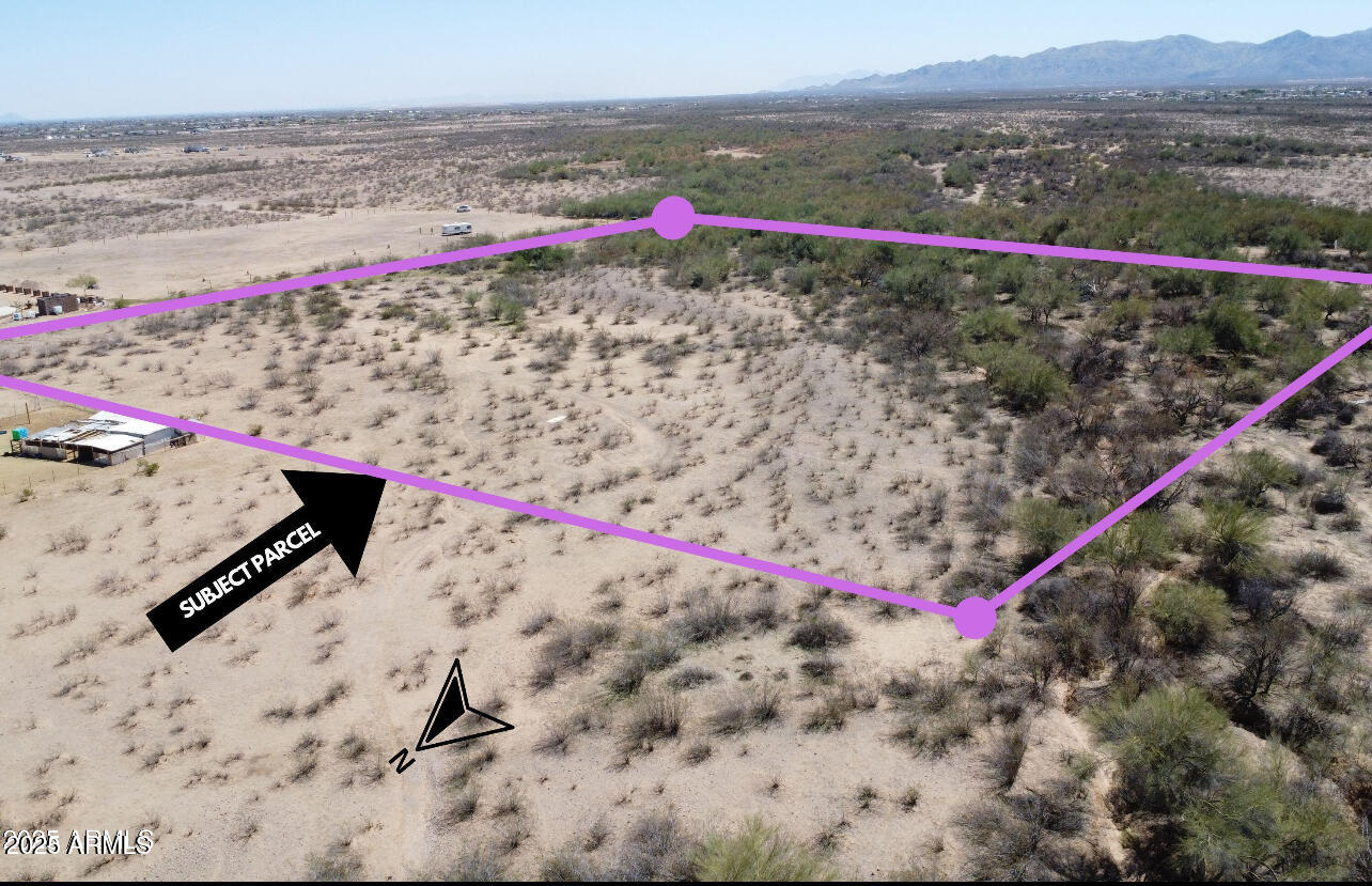 24128 West Radford Road Wittmann, AZ 85361 - Photo 3 of 8 a view of a road with an outdoor space