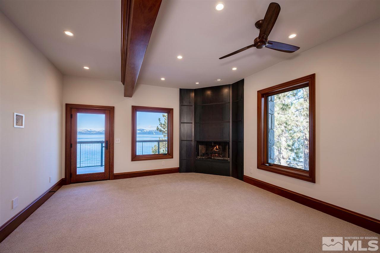 30 Lakefront Drive Glenbrook, NV 89413 - Photo 20 of 40 a view of an empty room with a window and fireplace