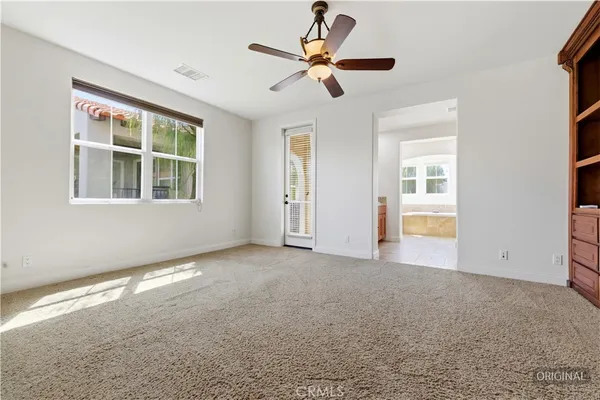 a view of an empty room with a cabinet