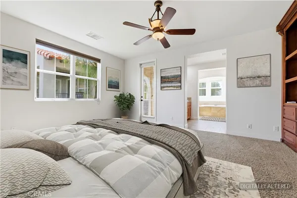 an empty room with closet and ceiling fan