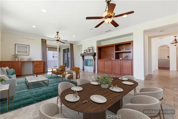 a view of a livingroom with furniture and a ceiling fan
