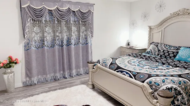 a living room with furniture and flowers