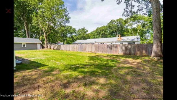 a swimming pool with some trees in the background