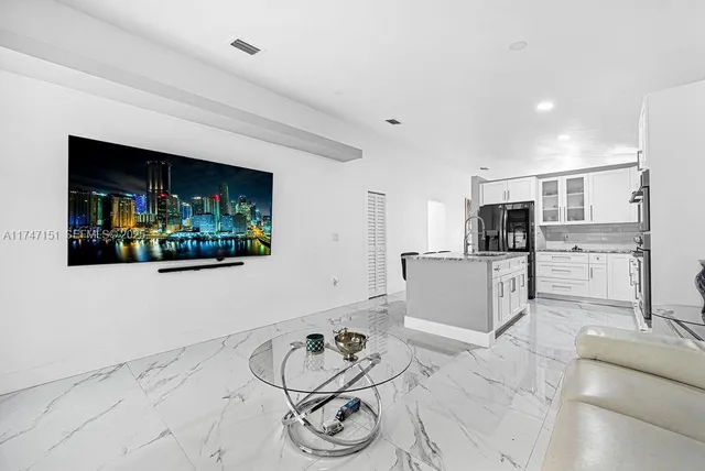 a view of a hallway with wooden shelves