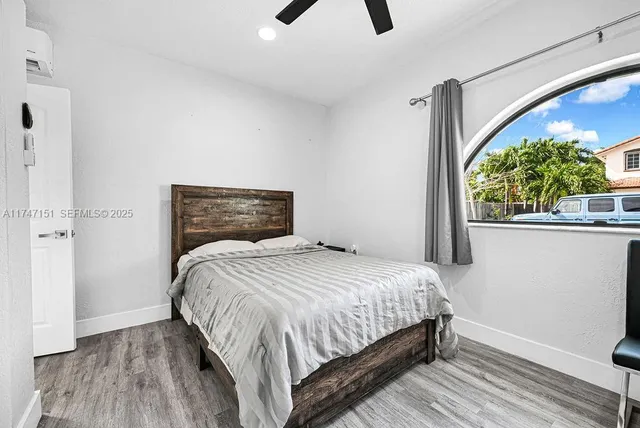 a kitchen with stainless steel appliances cabinets and a fireplace