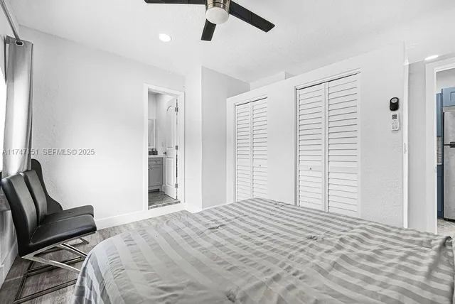 a kitchen with stainless steel appliances granite countertop a stove a microwave and a refrigerator