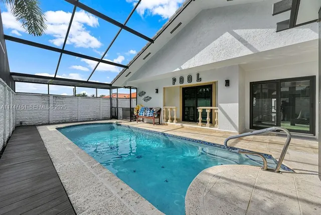 a balcony with furniture and a potted plant