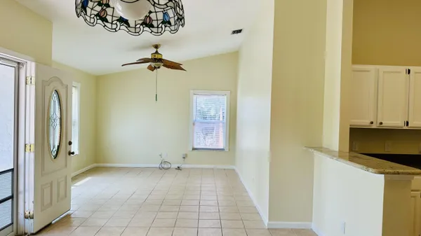 a view of a hallway with a chandelier