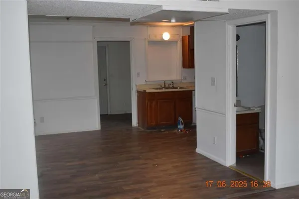 a room with wooden floor and furniture