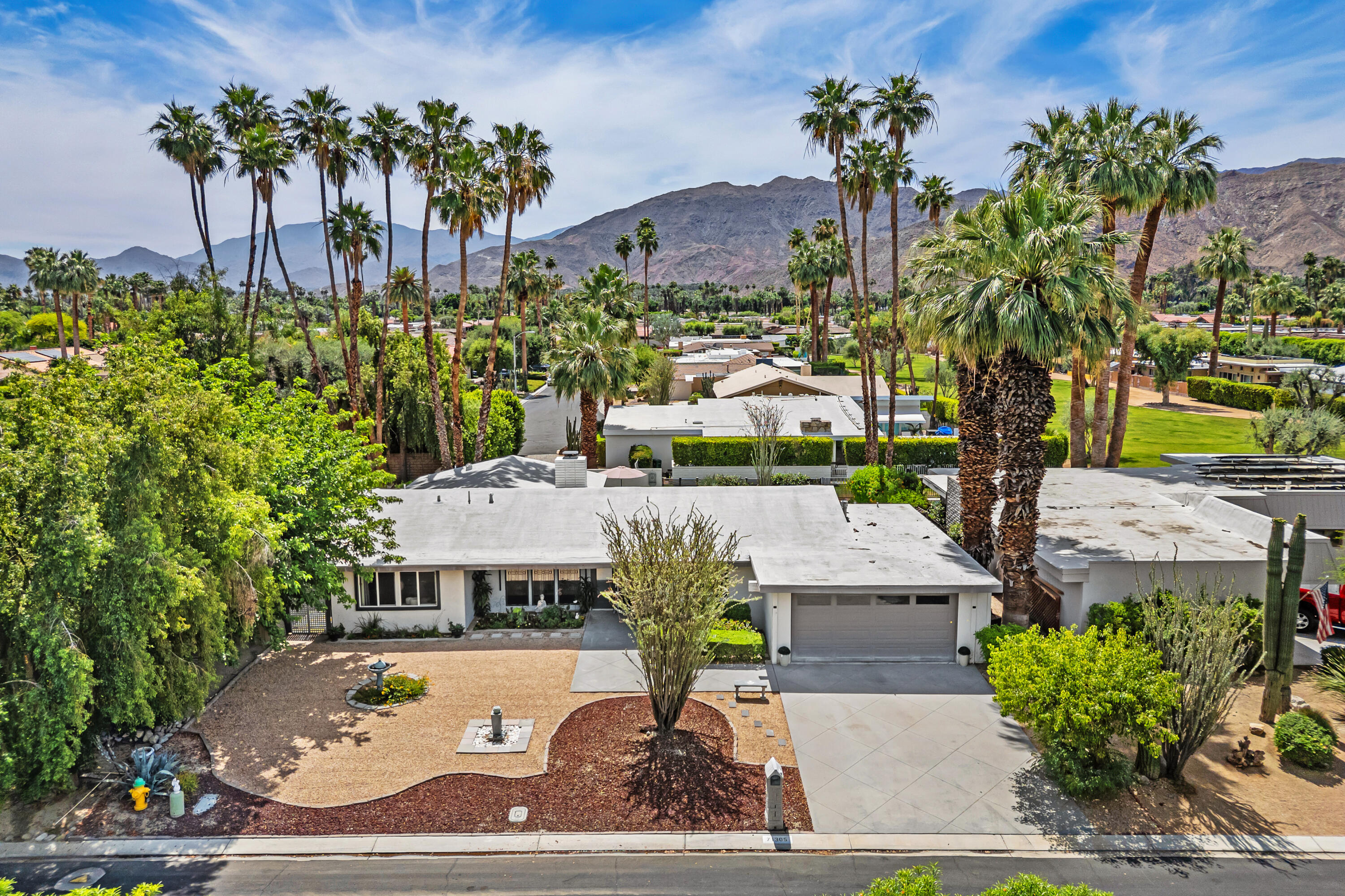 71305 Kempton Avenue Rancho Mirage, CA 92270 - Photo 1 of 58 a view of a patio with table and chairs potted plants