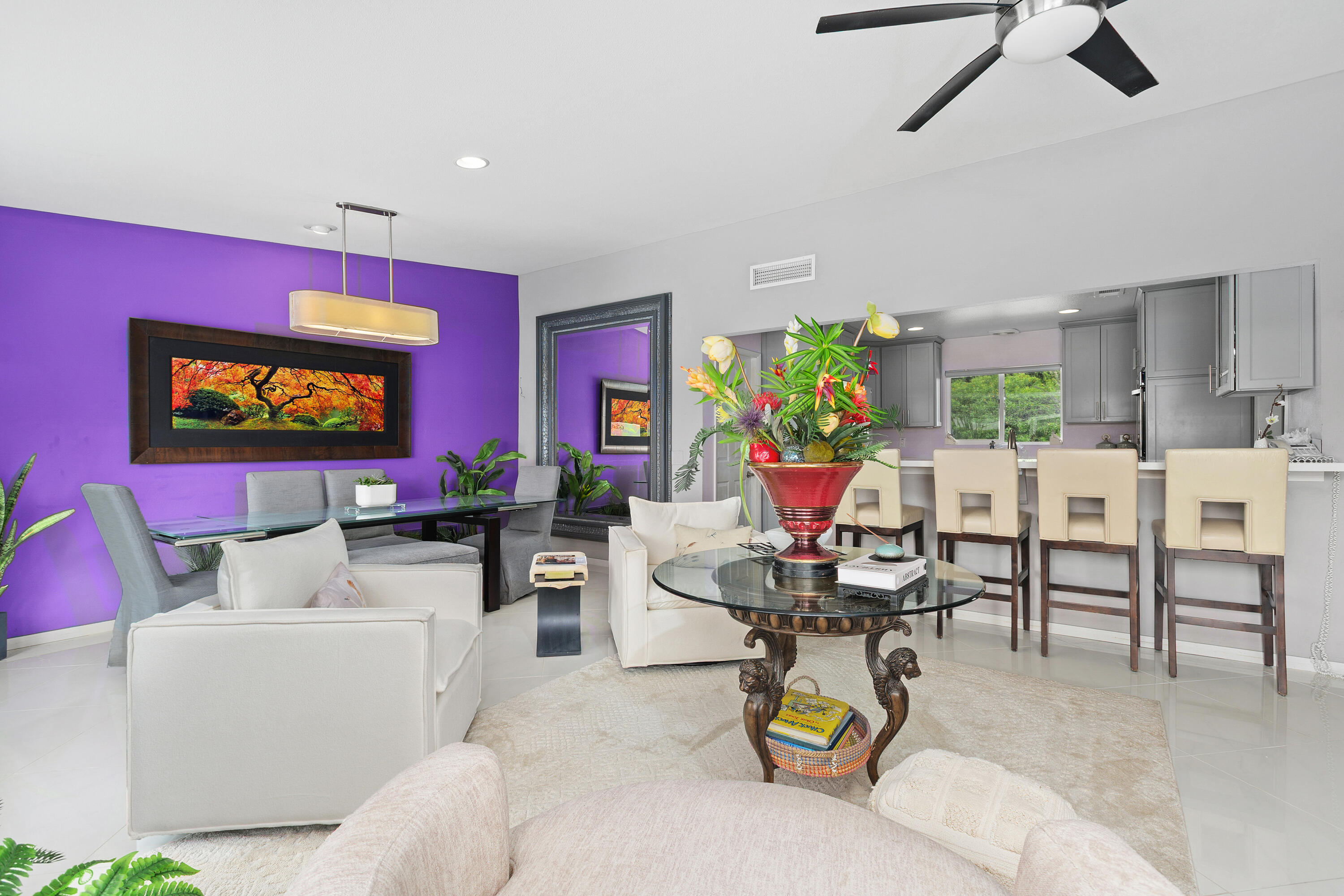 71305 Kempton Avenue Rancho Mirage, CA 92270 - Photo 19 of 58 a living room with furniture a chandelier fan and a window