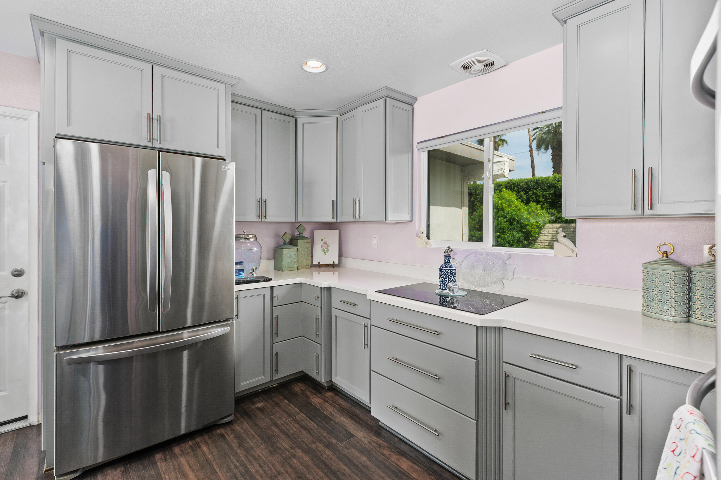 71305 Kempton Avenue Rancho Mirage, CA 92270 - Photo 23 of 58 a kitchen with a refrigerator sink and cabinets