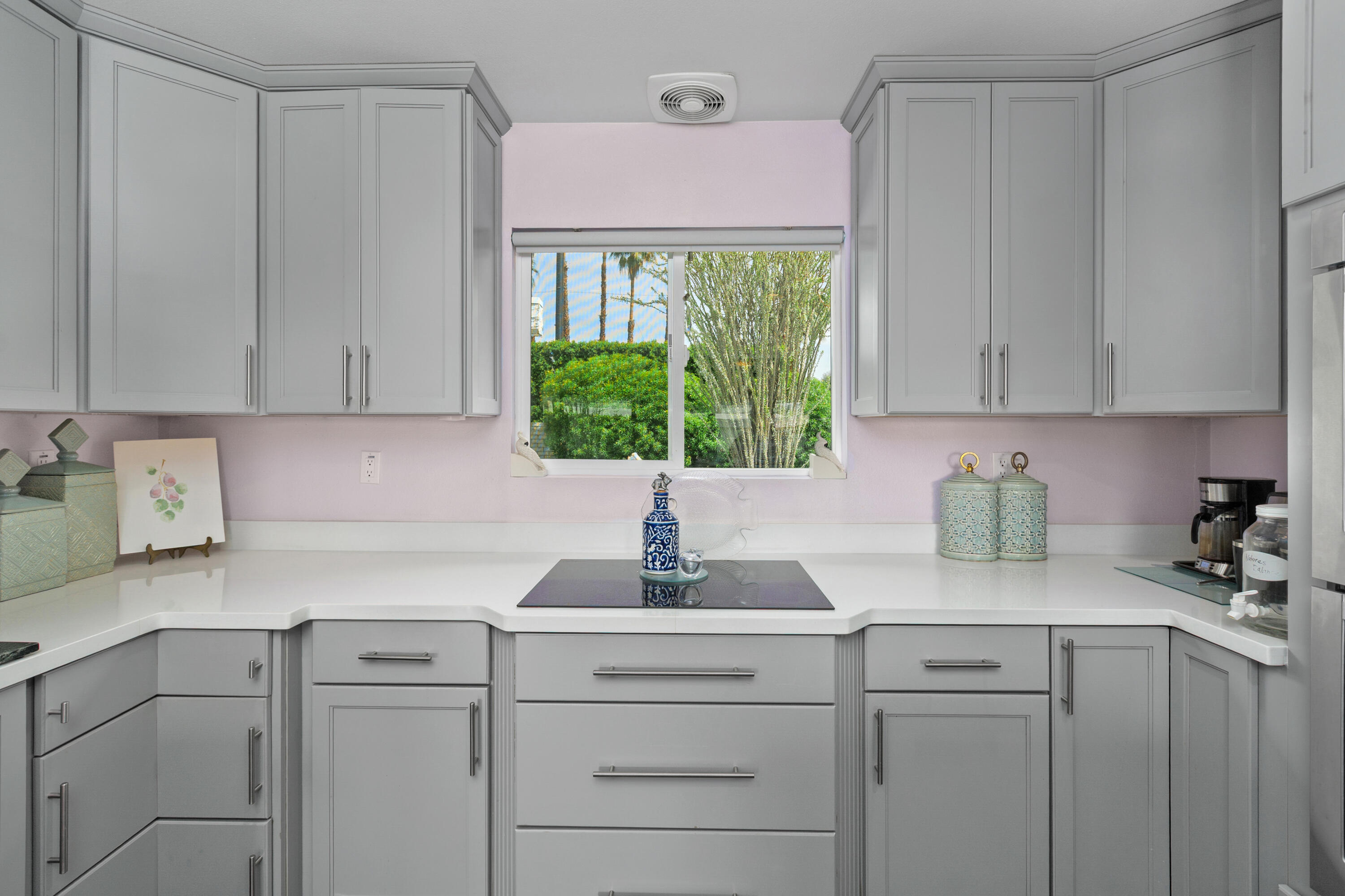71305 Kempton Avenue Rancho Mirage, CA 92270 - Photo 24 of 58 a kitchen with a sink cabinets and window