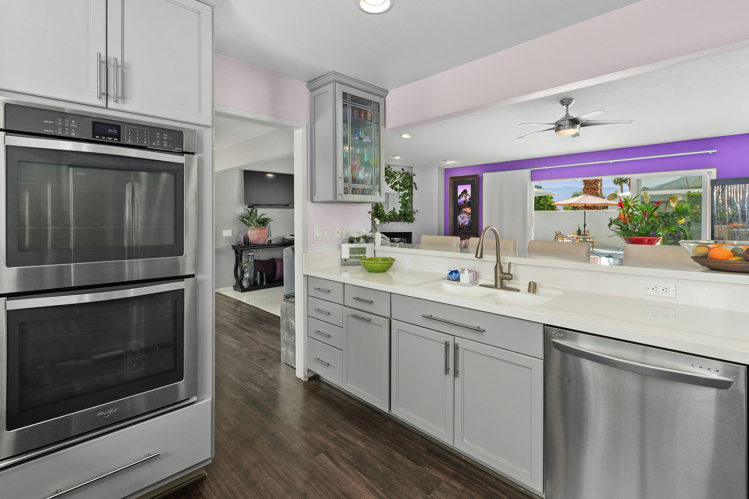71305 Kempton Avenue Rancho Mirage, CA 92270 - Photo 25 of 58 a kitchen with stainless steel appliances sink and cabinets