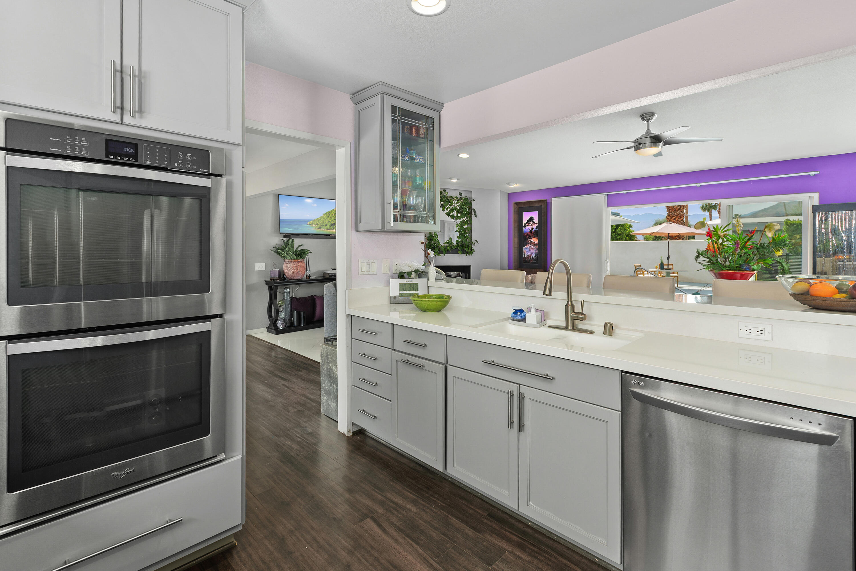 71305 Kempton Avenue Rancho Mirage, CA 92270 - Photo 26 of 58 a kitchen with stainless steel appliances sink and cabinets