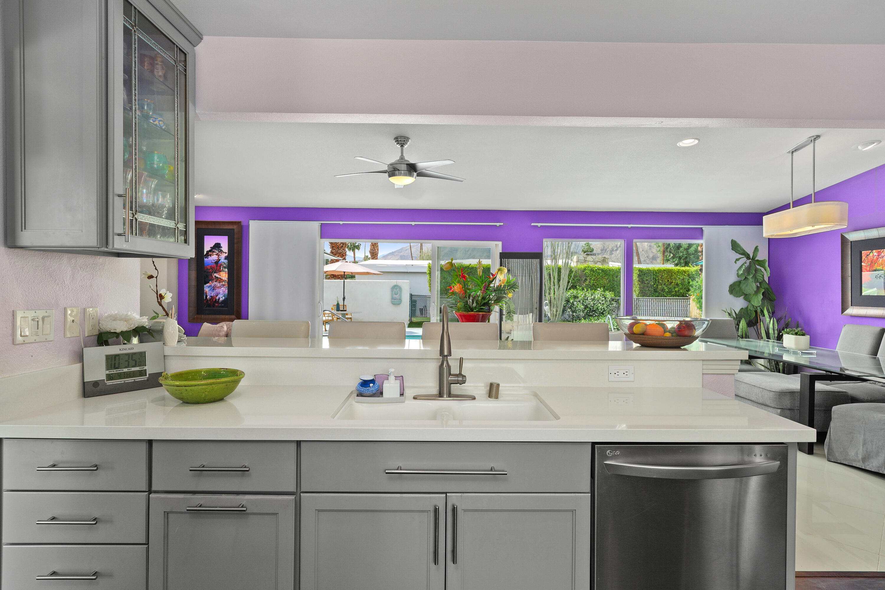 71305 Kempton Avenue Rancho Mirage, CA 92270 - Photo 27 of 58 a kitchen with a sink and a large window