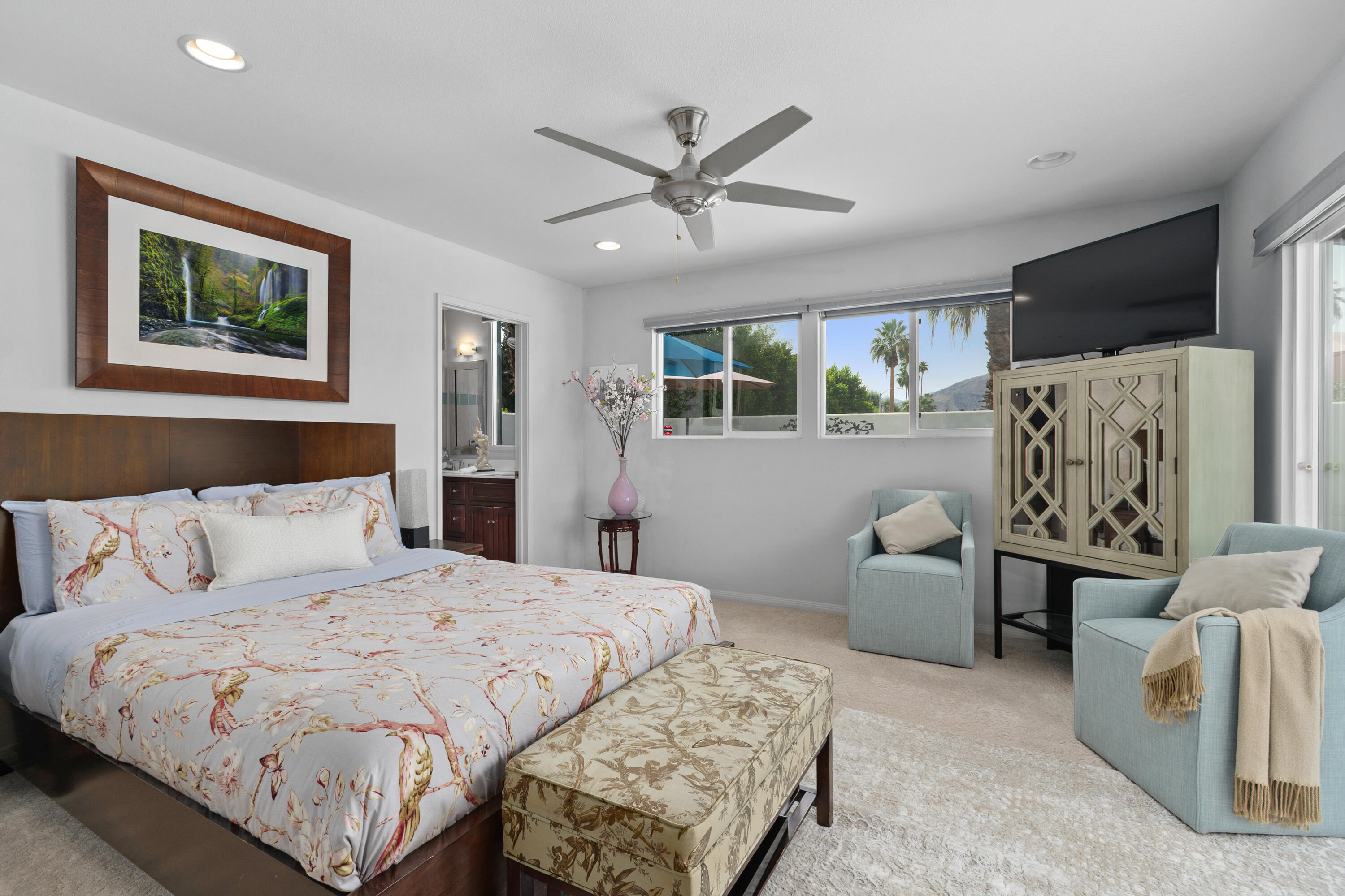 71305 Kempton Avenue Rancho Mirage, CA 92270 - Photo 29 of 58 a bedroom with a large bed and a couch