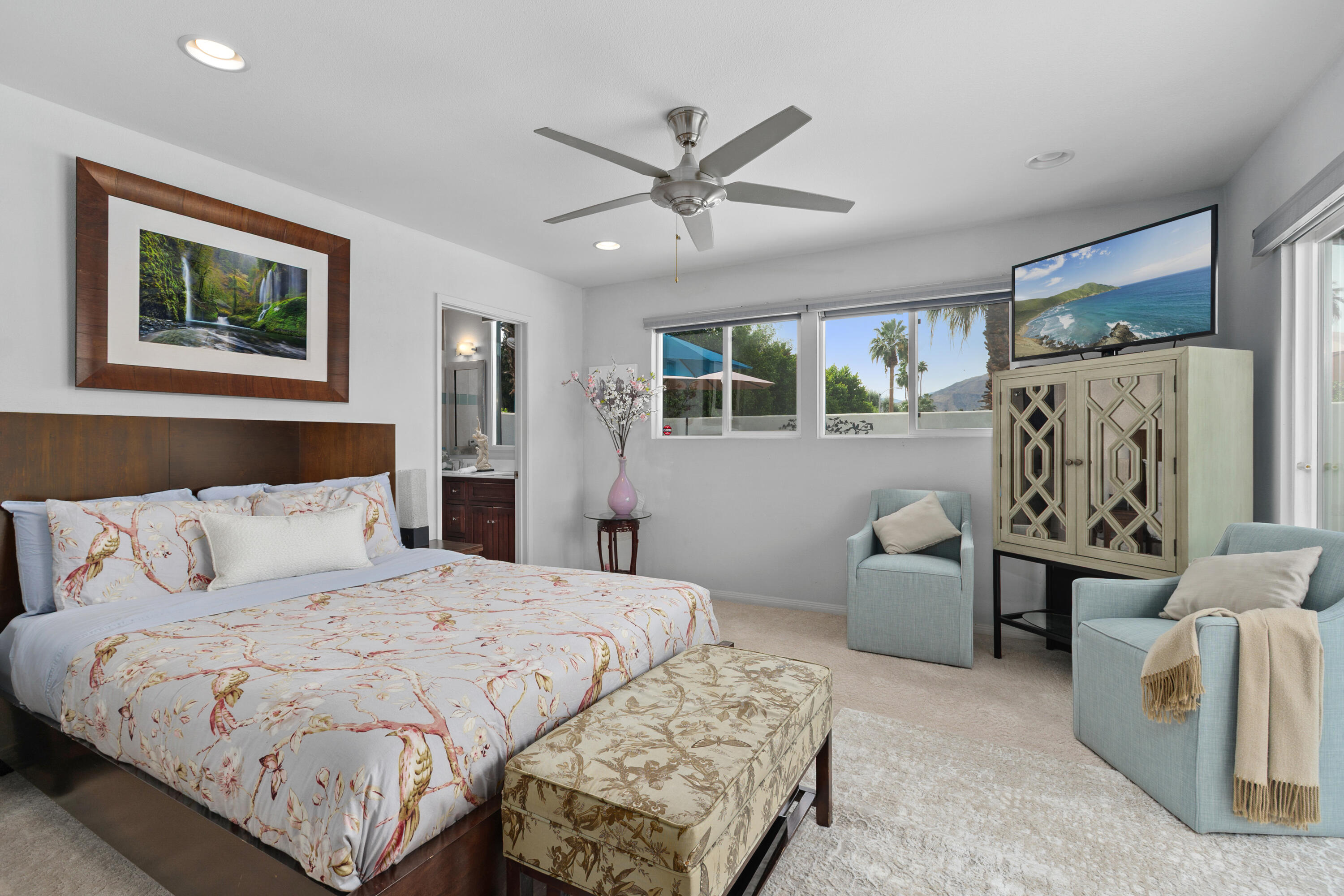 71305 Kempton Avenue Rancho Mirage, CA 92270 - Photo 30 of 58 a bedroom with a large bed and a couch