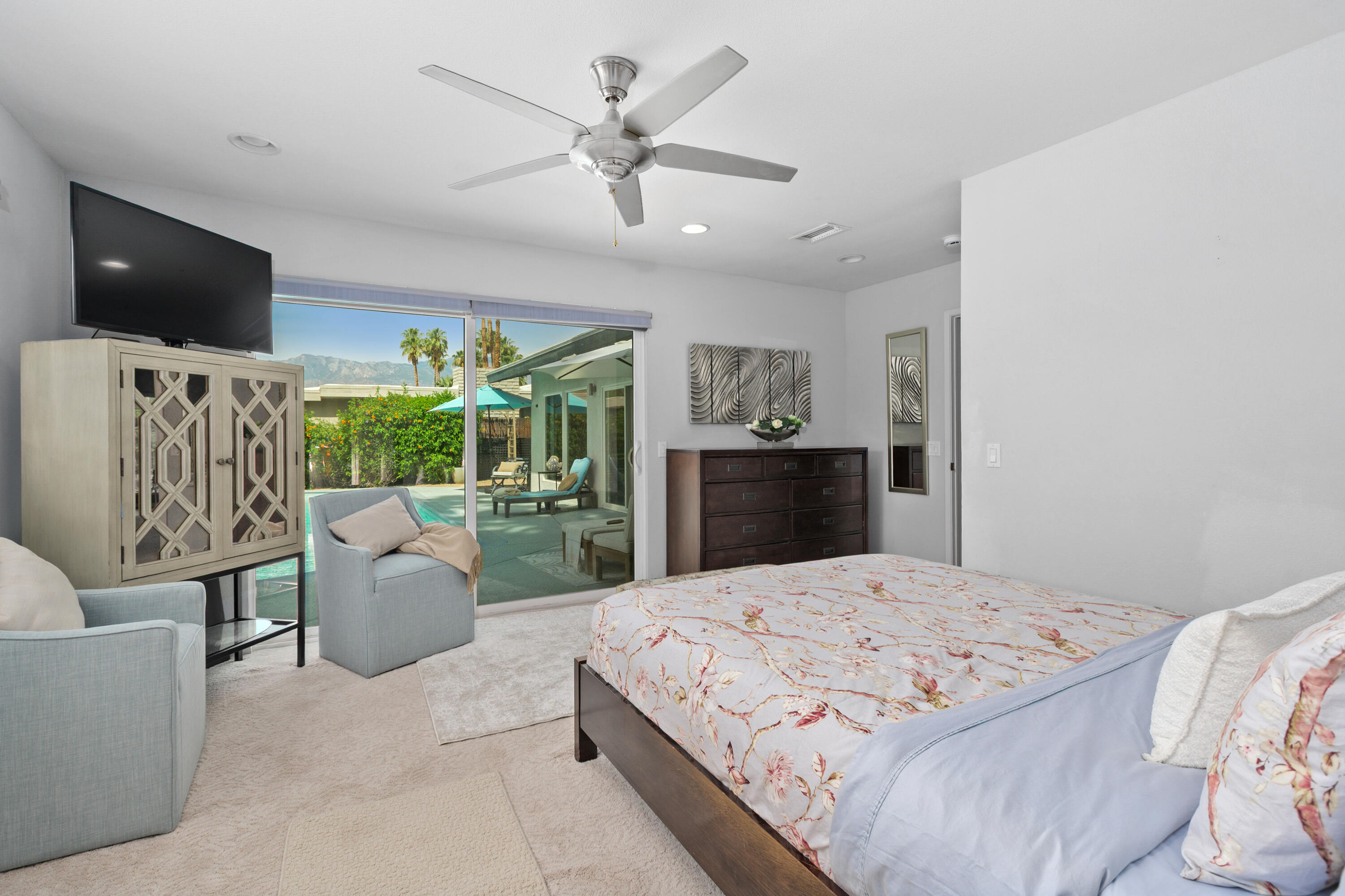 71305 Kempton Avenue Rancho Mirage, CA 92270 - Photo 31 of 58 a bedroom with a large bed and a flat screen tv