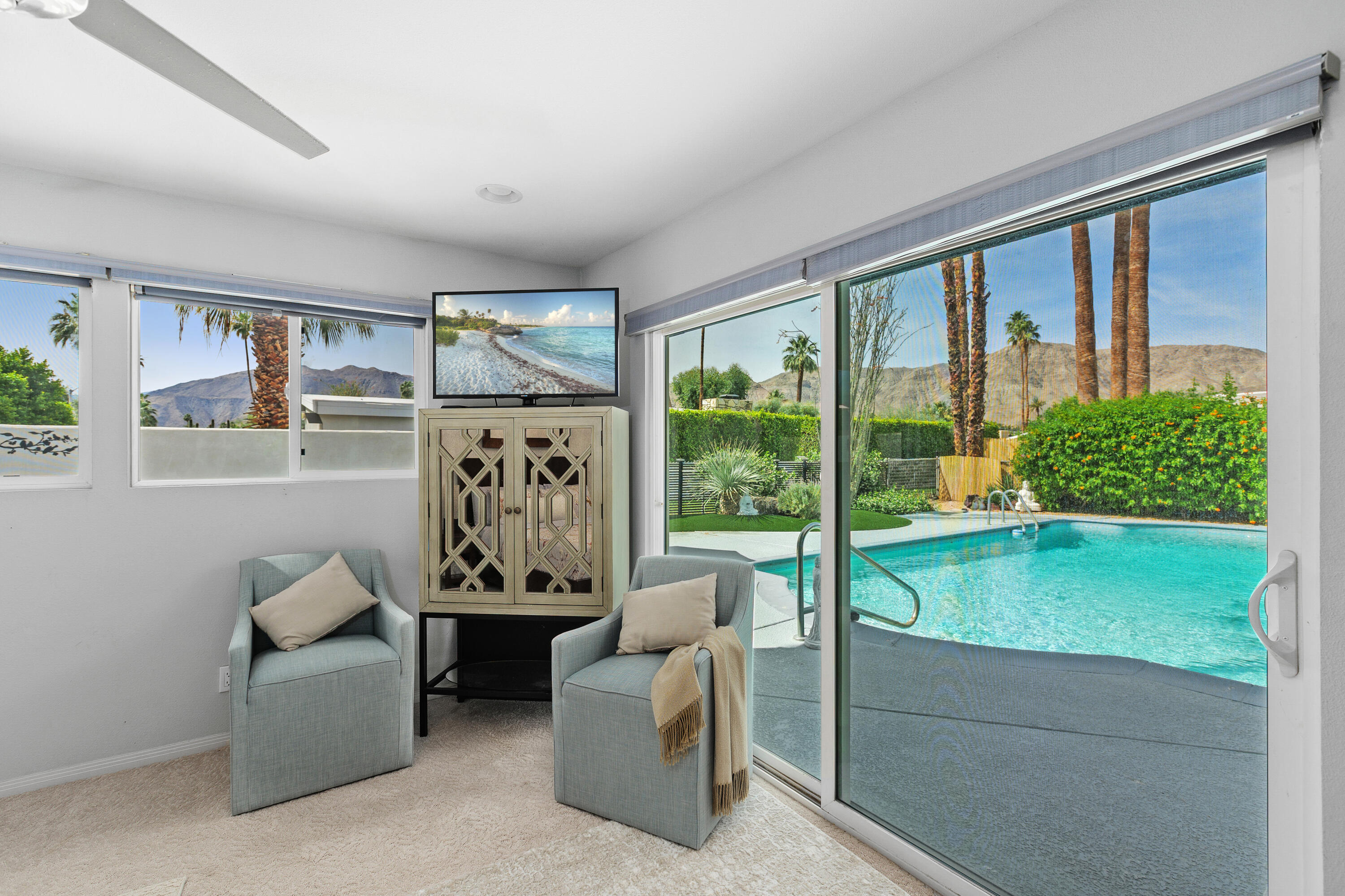 71305 Kempton Avenue Rancho Mirage, CA 92270 - Photo 34 of 58 a living room with furniture and a large window