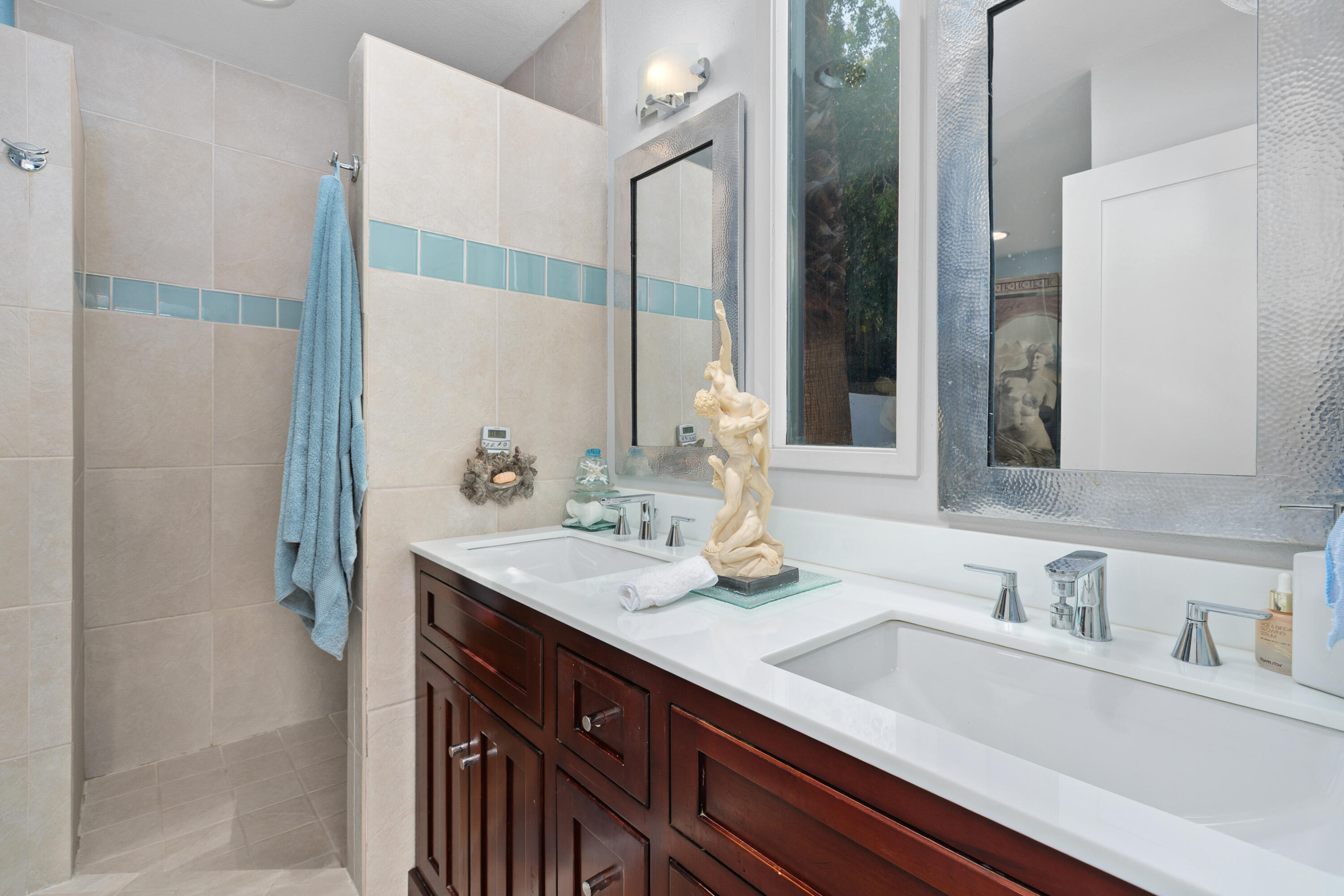 71305 Kempton Avenue Rancho Mirage, CA 92270 - Photo 35 of 58 a bathroom with a sink and a mirror